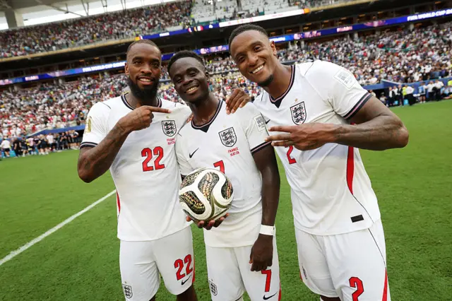 Bukayo Saka #7 of England poses for a photograph with the match ball after his hat trick