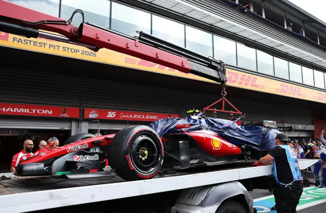 The damaged Ferrari of Lewis Hamilton on a recovery truck after his crash in the final moments of final practice for the Belgian Grand Prix