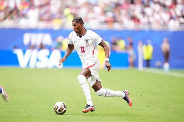 Marcus Rashford of England runs with the ball