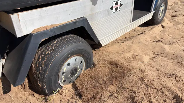A buggy stuck in the sand at Royal Birkdale