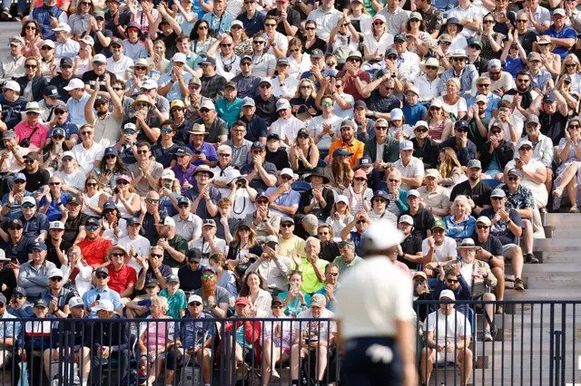 A crowd watches Tommy Fleetwood