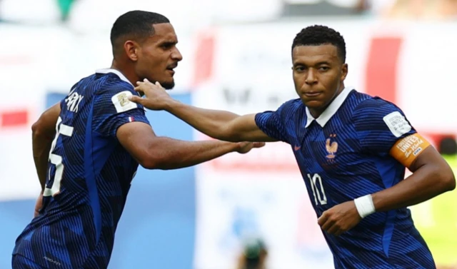 France's Kylian Mbappe celebrates scoring their third goal with Maxence Lacroix