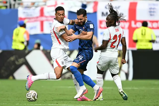 Morgan Rogers and England's midfielder #21 Eberechi Eze fight for the ball with France's forward #24 Rayan Cherki
