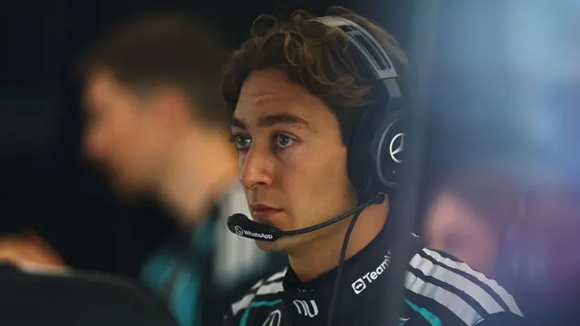 George Russell in the Mercedes garage