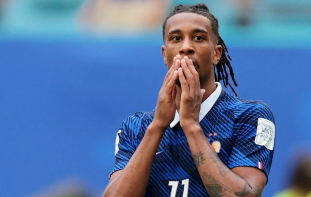 France's Michael Olise reacts after missing a chance to score