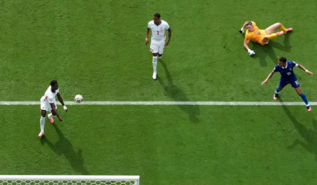 England's Marc Guehi makes a save from France's Kylian Mbappe