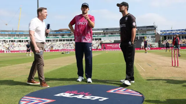 David Willey of Northants and Lewis Gregory of Somerset at the toss before the match
