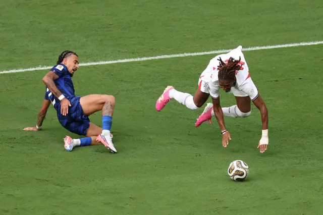 Djed Spence #25 of England is fouled by Malo Gusto