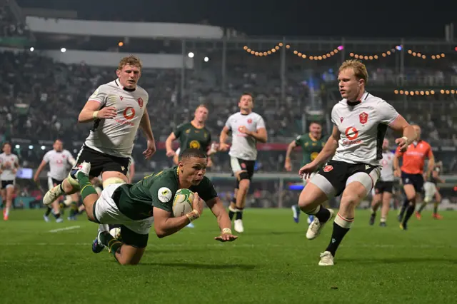 Jaco Williams of South Africa dives in to score his team's fourth try