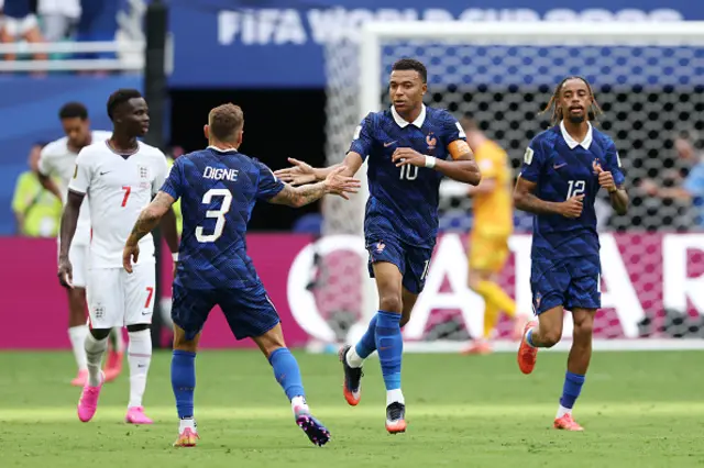 Kylian Mbappe #10 of France celebrates with Lucas Digne