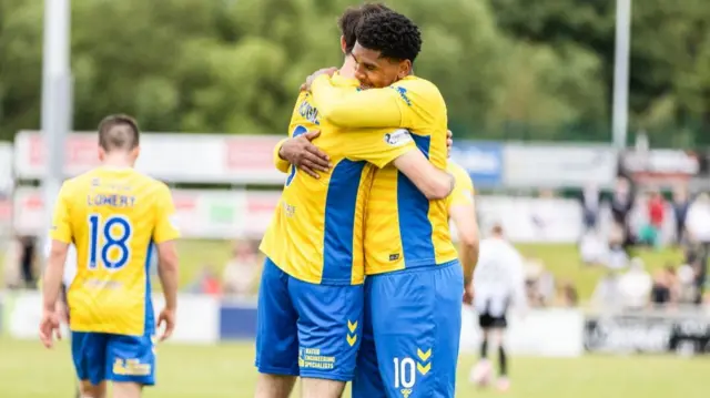 A late Joe Hugill goal secured three points for 10-man Kilmarnock at Elgin