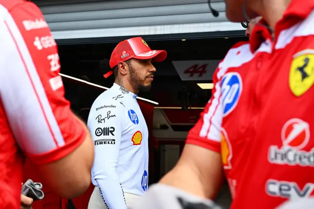 Lewis Hamilton walks back to the garage after his crash in second practice