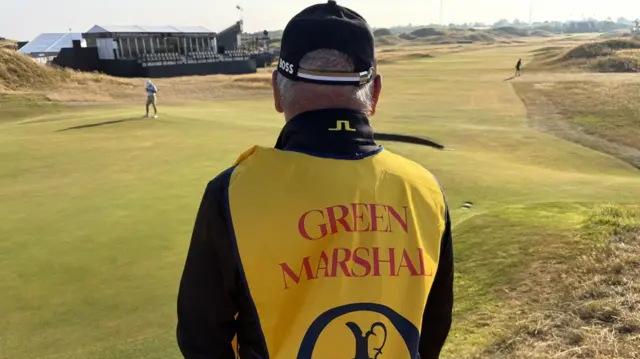 A green marshal at Royal Birkdale