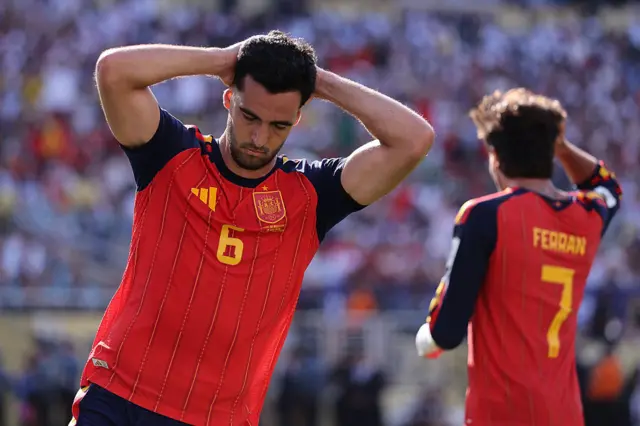 Merino puts his hands to his head after missing a golden chance