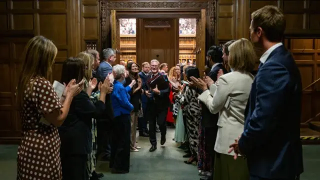 Keir Starmer leaving the House of Commons to rows of clapping from his colleagues after his last Prime Minister's Questions ever on Wednesday