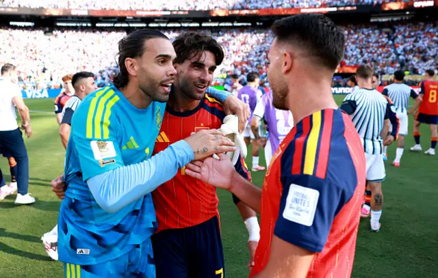 David Raya #1, Ferran Torres #7 and Eric Garcia #4 of Spain celebrate the World Cup champions