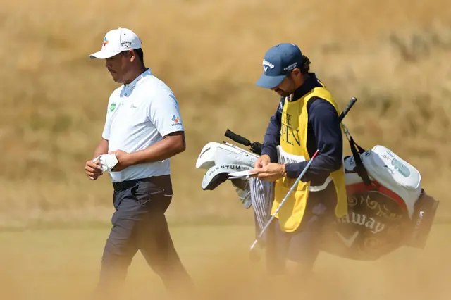 Kim Si-woo walking with his caddie