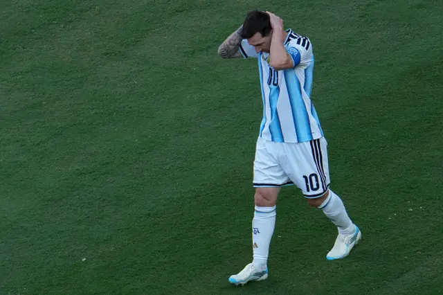 Lionel Scaloni watches his players from the touchline
