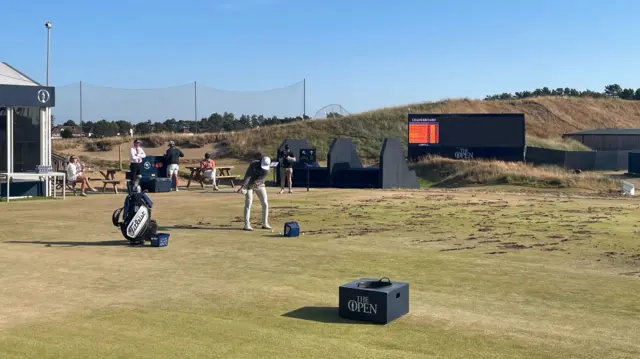 Cameron Young hitting a shot at the range