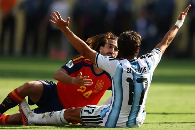 Giuliano Simeone (R) reacts in front of Spain's defender #24 Marc Cucurella