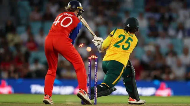 Chloe Tryon of South Africa is bowled by Sophie Ecclestone of England