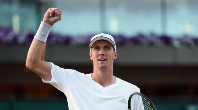 Jan Choinski holds up his arm