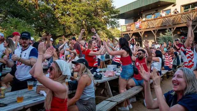 USA fans celebrate at the Armadillo Den in Austin, Texas