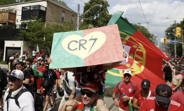 General view of a Portugal fan with a Cristiano Ronaldo banner