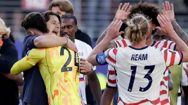 USA players and staff celebrate their win over Bosnia-Herzegovina