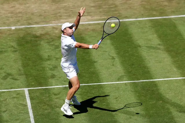 Arthur Fery of Great Britain plays a backhand volley