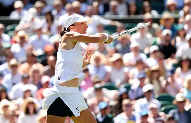 Iga Swiatek hits a forehand