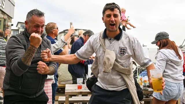 England fans celebrate in Perranporth