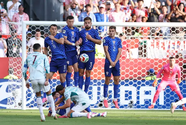Ante Budimir #11, Ivan Perisic #14, Marin Pongracic #3, and Josip Stanisic #2 of Croatia block a free kick from Cristiano