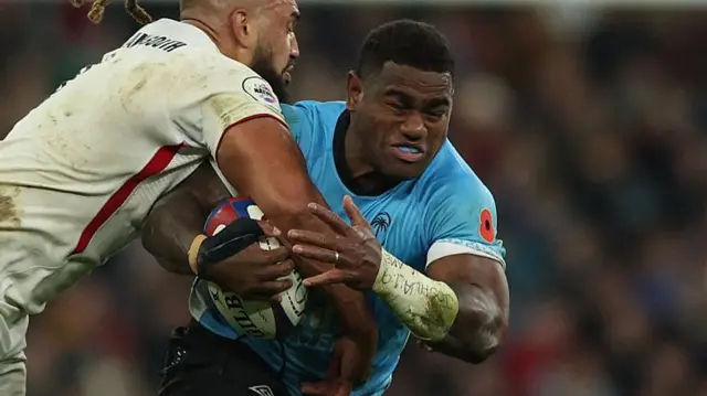 Josua Tuisova carries the ball for Fiji against England