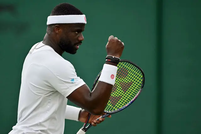 Frances Tiafoe holds up his fist