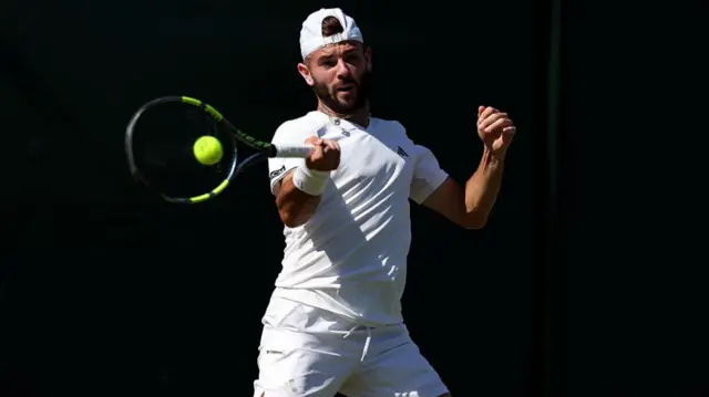 Jacob Fearnley hits a forehand