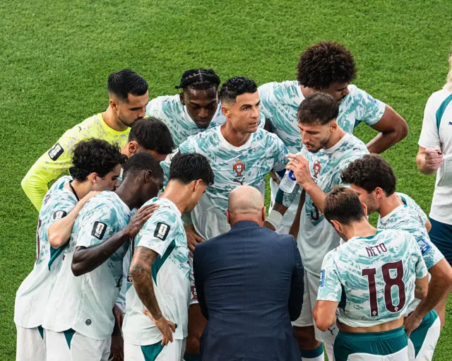 Head Coach Roberto Martinez of Portugal speaks with his players