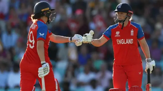 Nat Sciver-Brunt and Heather Knight of England interact