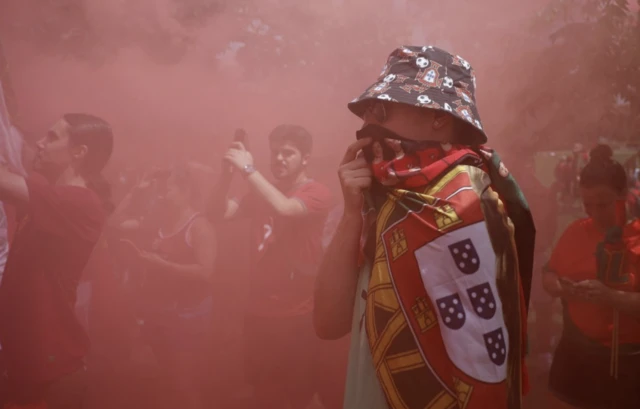 Portugal fans gather before the march to the stadium