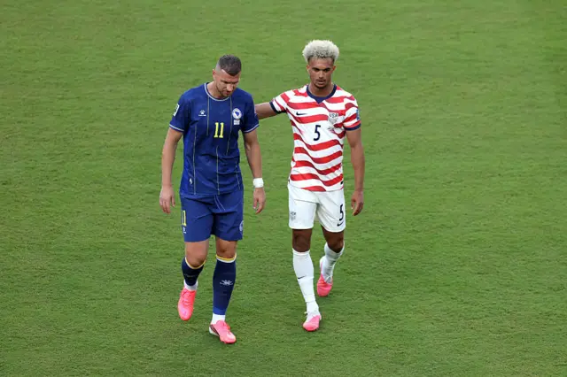 Antonee Robinson and Edin Dzeko