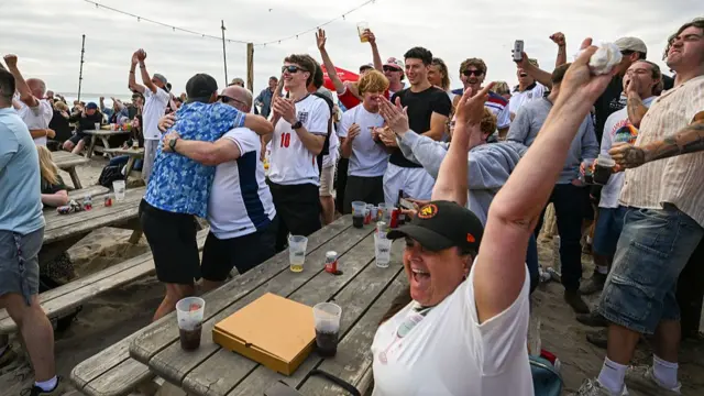 England fans celebrate in Perranporth