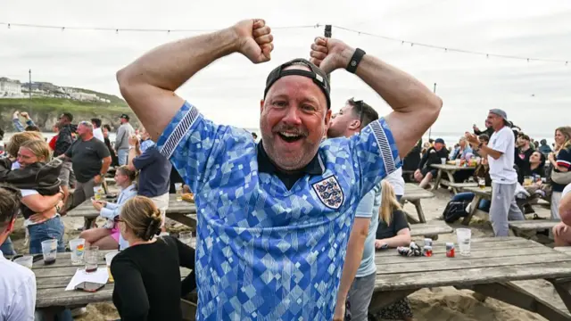 England fans celebrate in Perranporth