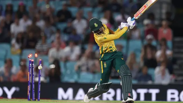 Ayabonga Khaka of South Africa is bowled by Lauren Bell of England