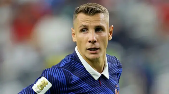 Lucas Digne looking just off camera while playing for France