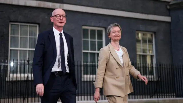 Cooper and McFadden smile and walk