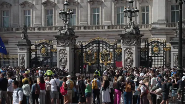 Crowds gathering outside Buckingham Palace