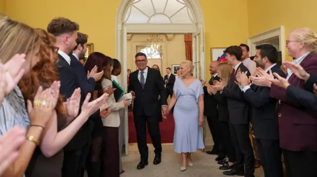 Andy Burnham and his wife Marie-France van Heel in Downing Street