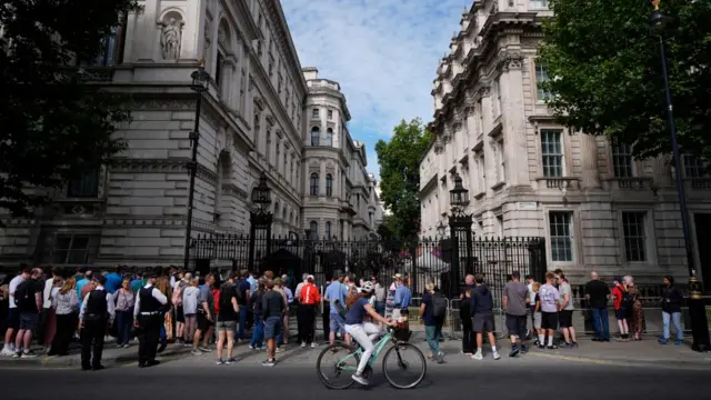 Members of the public outside Downing Street, London.