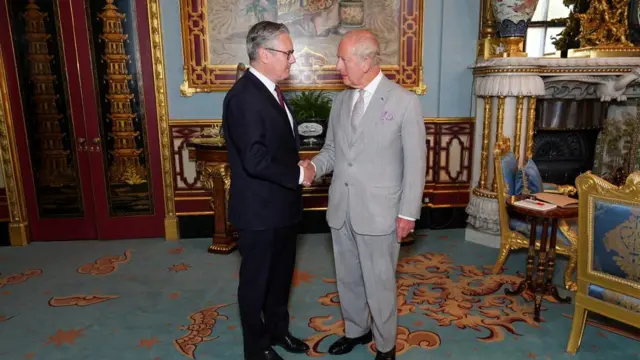 Keir Starmer shaking hands with the King at Buckingham Palace as he tendered his resignation