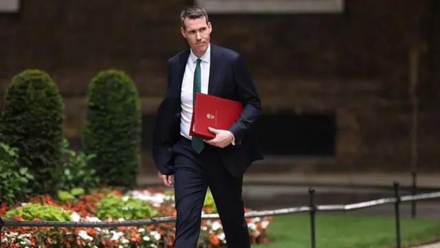 Matthew Pennycook, wearing a suit, walking into No 10